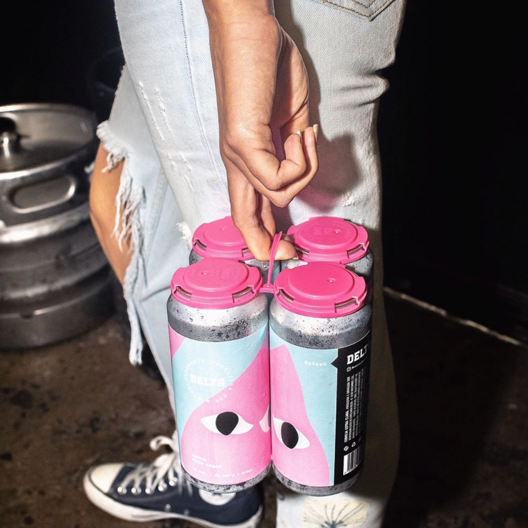 PakTech Pink Can Handles Held by Person in Ripped Jeans